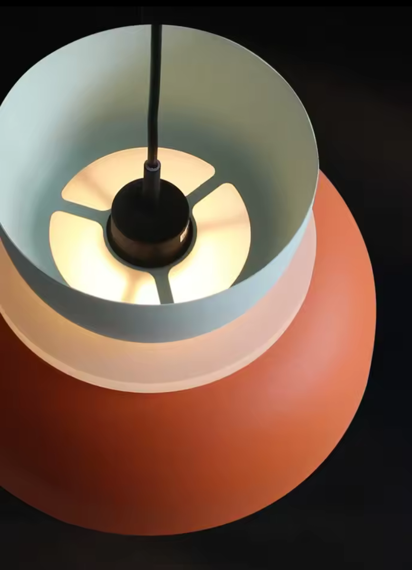 Close-up of the Modal pendant light with white and clay base