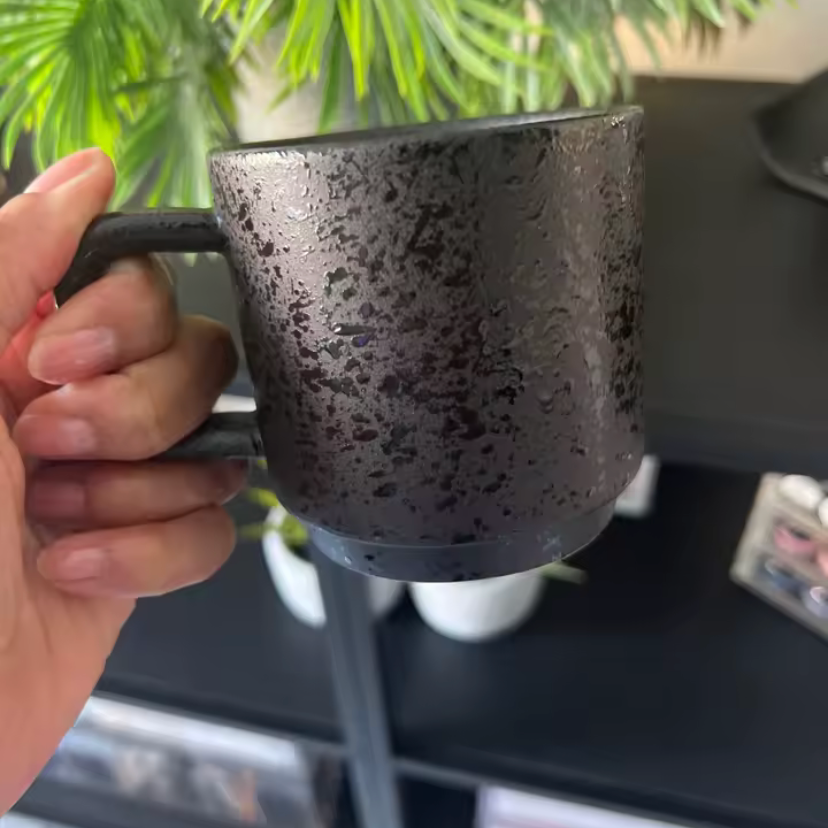 Emberstone mug in persons hand
