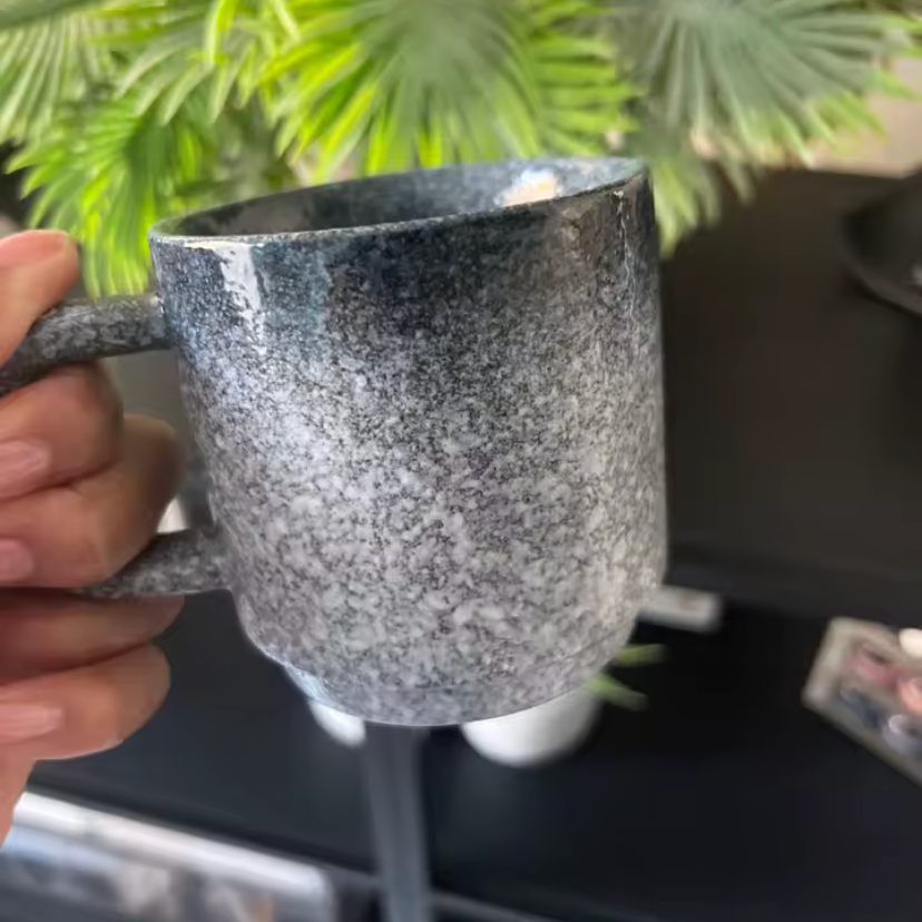 Emberstone white mug in persons hand