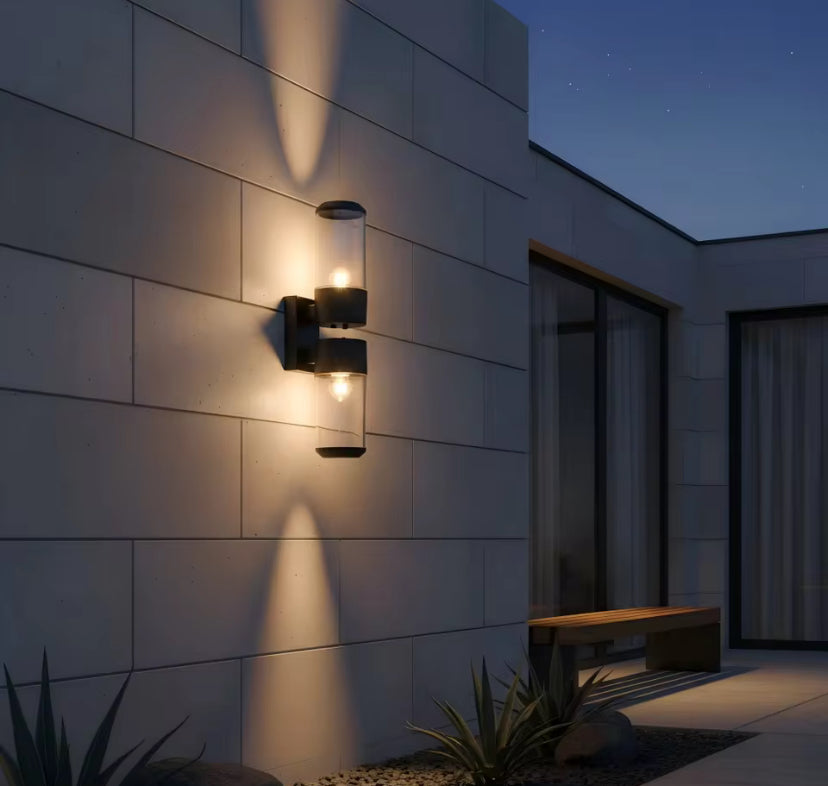 Lumièra Halo Glass Cylinder Wall Sconce modern wall light fixture on building exterior At night