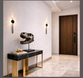 Modern interior with console table and T-Rex trophy decorative skull and Travertine stone sconces