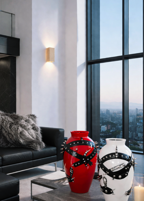 Modern luxurious living room with Supreme Vases in Red and White and Travertine Sconce.