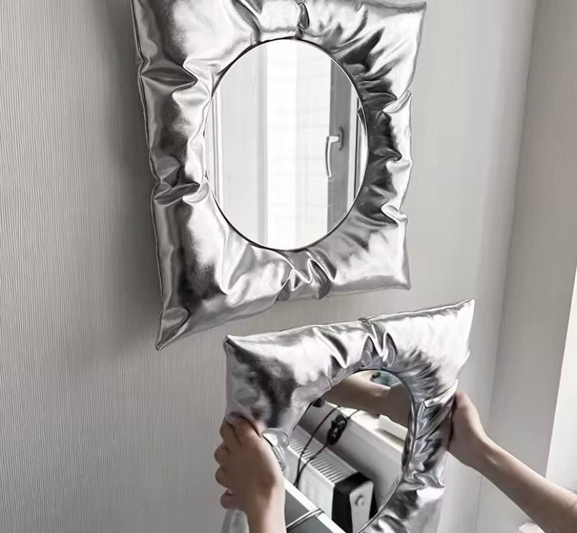 Person hanging chrome PillowMirrorrs