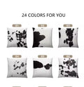 Real cow hide pillows with black and white patterns on a white background