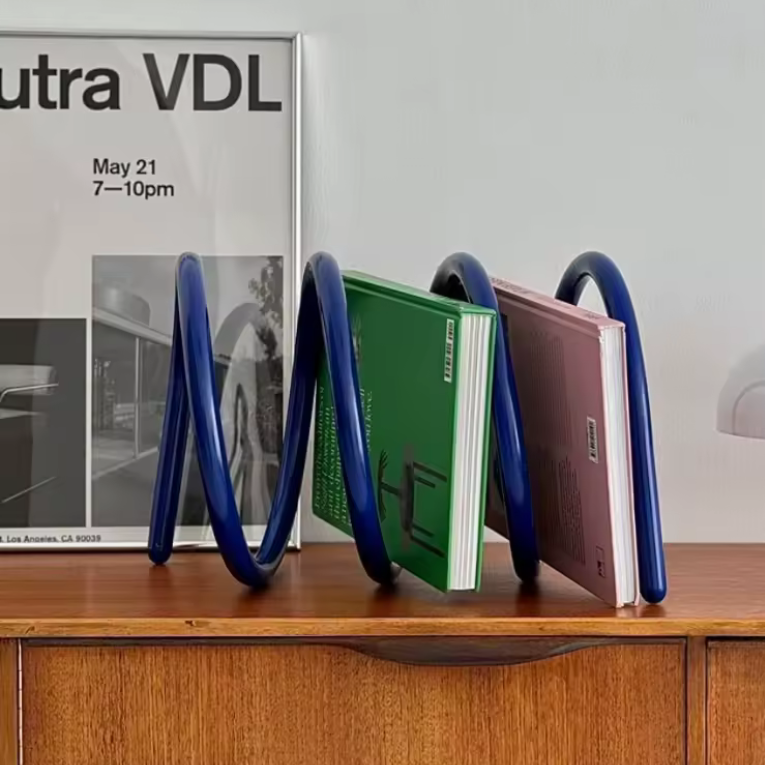 Ripple rack a unique modern colourful book rack and bookend for interior design and style in blue with books on it on shelf