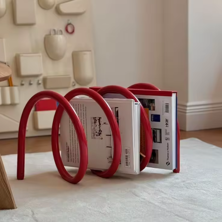 Ripple rack a unique modern colourful book rack and bookend for interior design and style in red with books on it in Livingroom 
