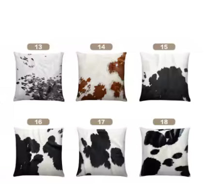 Set of real cow hide cushions with different patterns on a white background