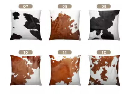 Set of real cow hide pillows with different patterns on a white background