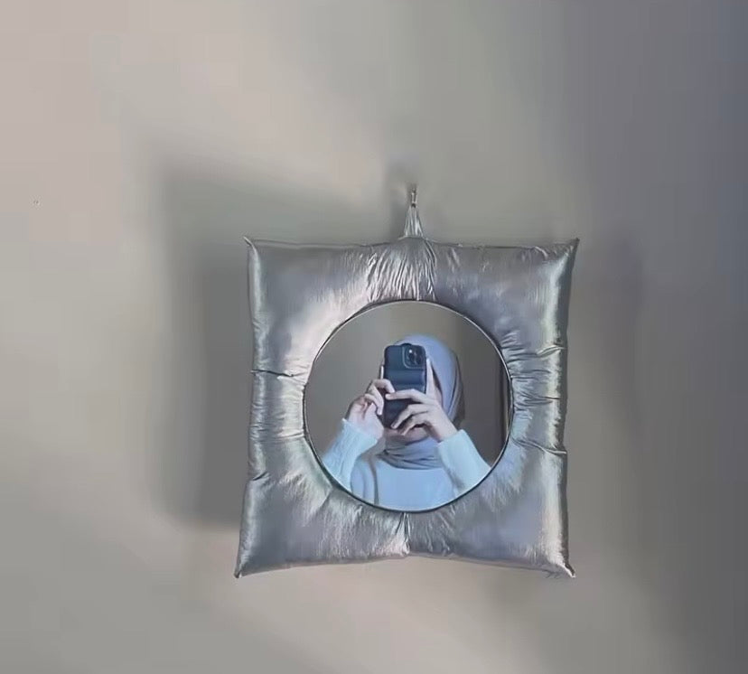 Silver Pillow Mirror on wall