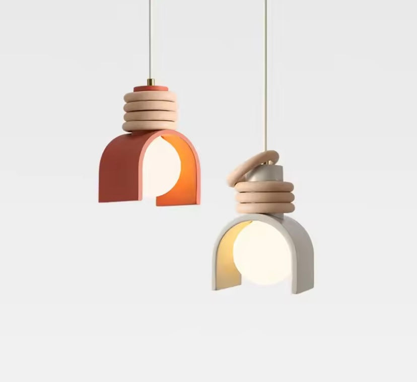 Two modern pendant lights in geometric stylish designs on a white background 