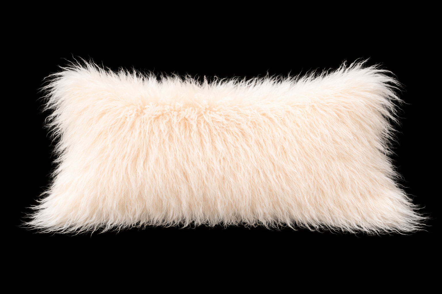 White fluffy Mongolian lamb fur lumbar pillow on a black background 